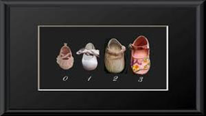 Shadow Box Display Framed used to display baby shoes